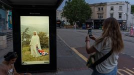 An image of a bus stop digital screen showing the artwork ‘Brit-ish’ (2023) by Azraa Motala.