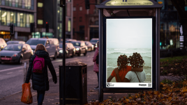 An image of a bus stop digital screen showing the artwork 'Home is far away’ (2022) by Ian Wainaina