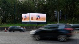 An image of a roadside billboard showing the artwork