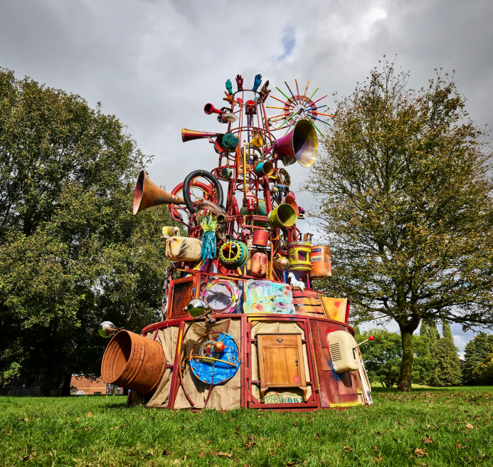 The Babylon Gamelan by Rag & Bone, created by artist Dave Young, 2024. A tower of junkyard treasures, bells, whistles, levers and buttons. The colourful installation moves like a magical machine. Produced by Artichoke as part of Nuneaton & Bedworth Borough Council’s Creative Explorers programme. Photo by Andrew Moore