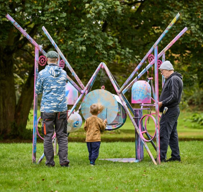 Aspire in Arts and Spencer Jenkins' installation. A multicolored inverted pyramic made out of pipes of different shapes and sizes. Produced by Artichoke as part of Nuneaton & Bedworth Borough Council’s Creative Explorers programme. Photo by Andrew Moore