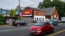 An image of a roadside billboard showing the artwork 