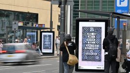 A busy city scene showing the artwork from The Gallery Season 4 on billboards. The artwork on display: Mosaic Art Nouveau tiles in Victorian blue & white with the quote 